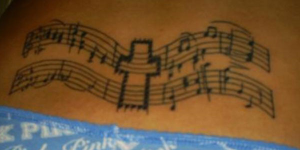 Music/cross tattoo
