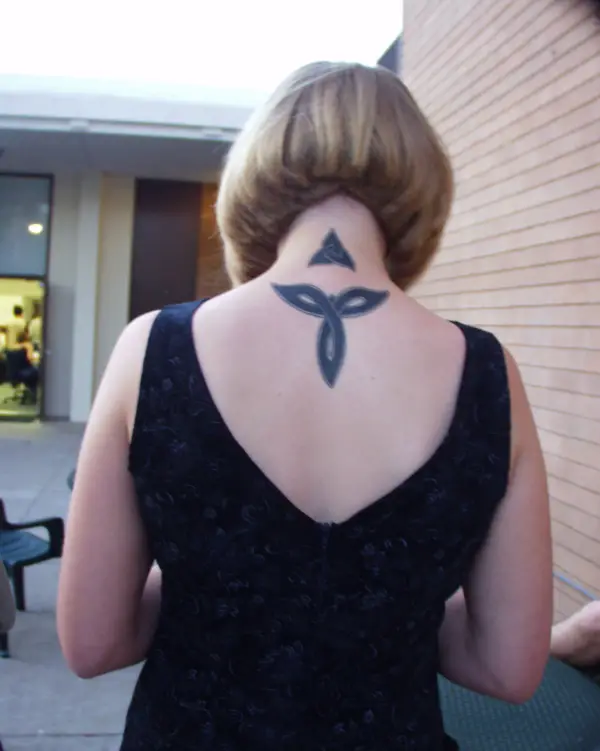 Celtic Knot On Her Upper Back