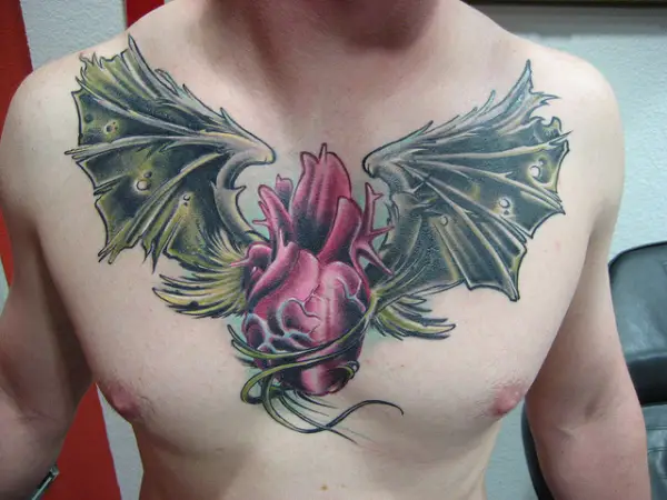 Heart Wings Tattoo At Chest
