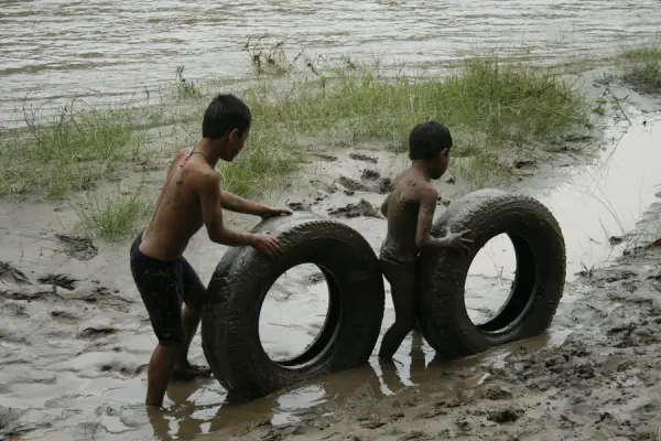 Children Playing In Mud
