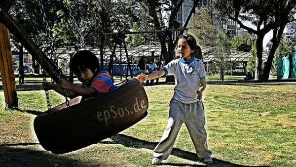 Latino Children Play Swing