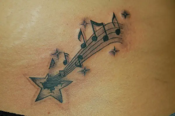 Shooting Star With Musical Notes Tattoo