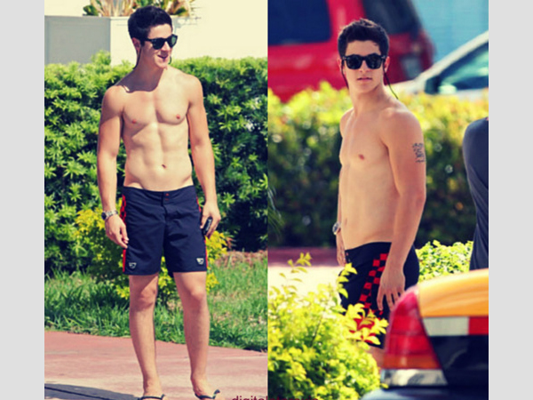 Walking in boxers, the gorgeous David Henrie showing off his left arm tatto...