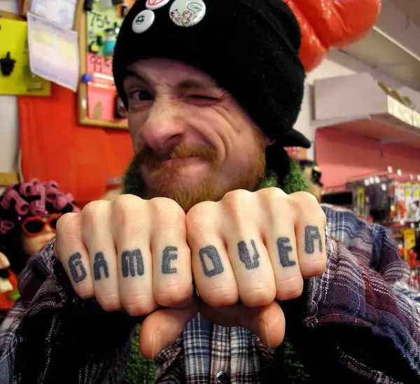 Game Over Knuckle Tattoo