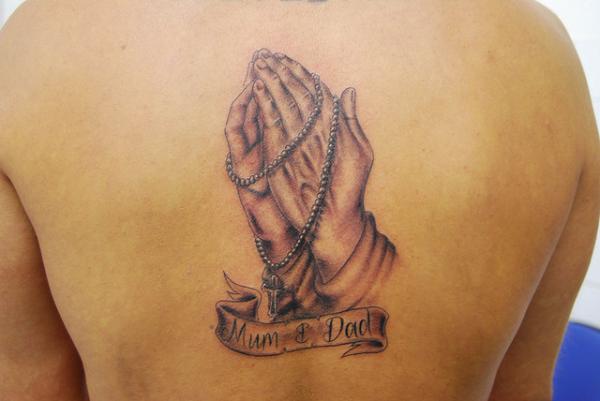 Praying Hands And Rosary On Back