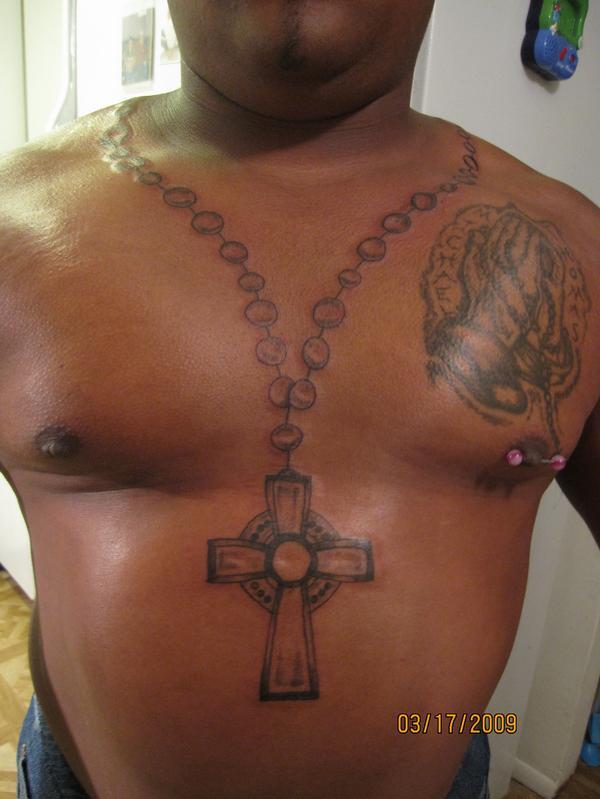 praying hands with rosary tattoo on chest