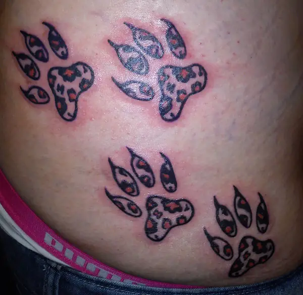 Leopard print claws tattoo