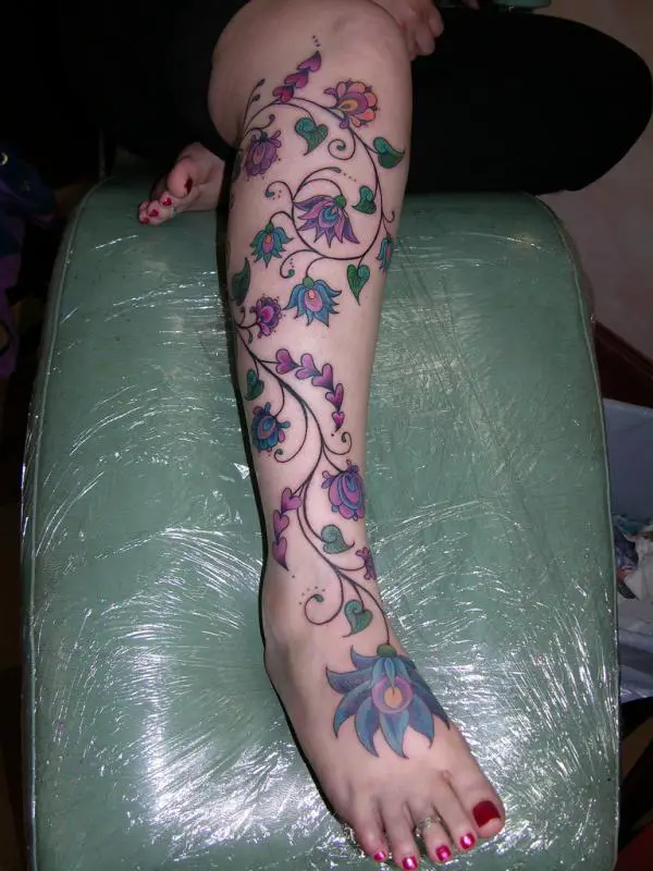 rose vine tattoo designs on the leg