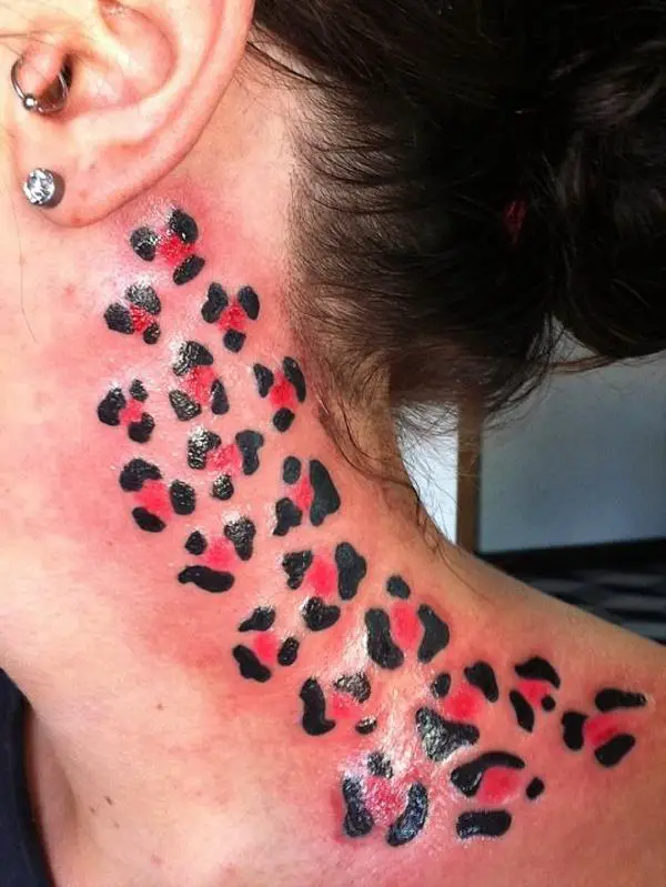 Black Light Neck Tattoo