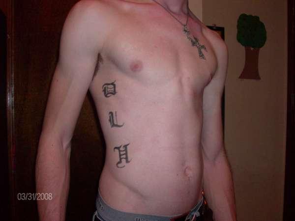 rib tattoos with initials