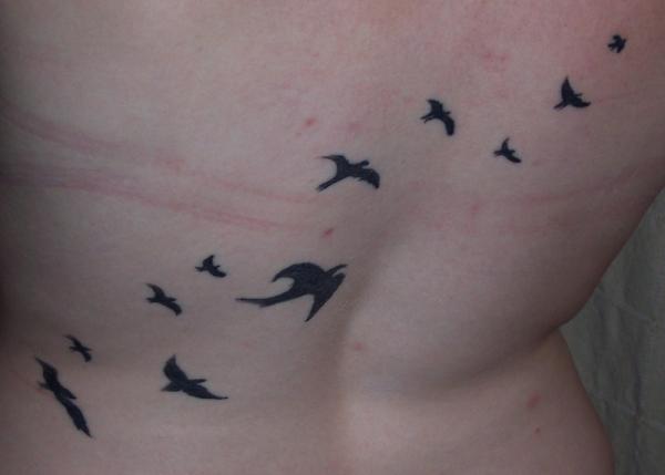 flying birds tattoo on back