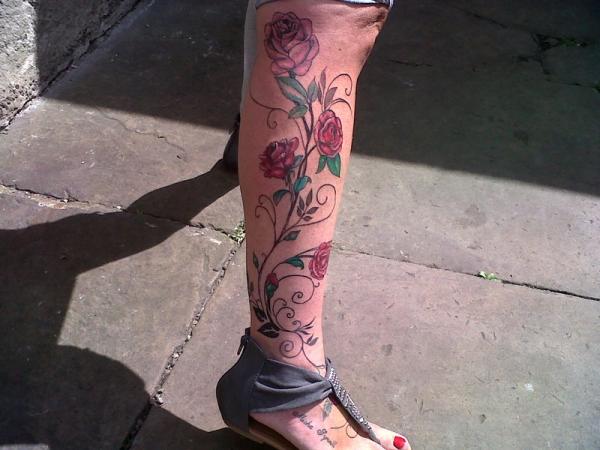 rose vine tattoo designs on the leg