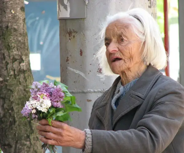 Old Woman Selling Flowers