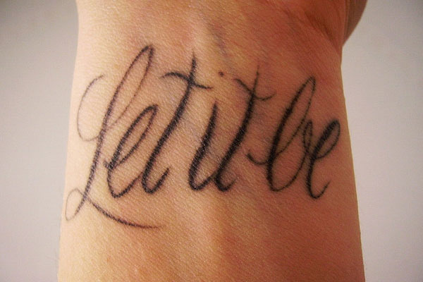 Let it be lettering tattoo on the wrist