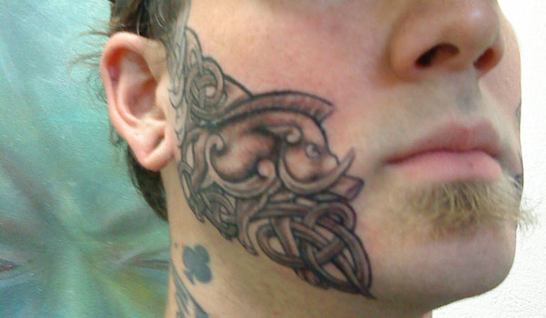 Half Cheek Tattoo