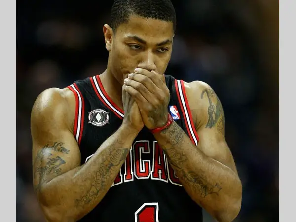 Derrick Rose has his both arms filled with tattoo designs and they make for...