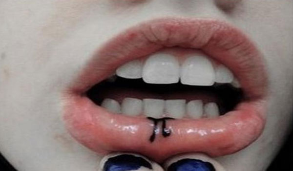 Tiny Lip Tattoo