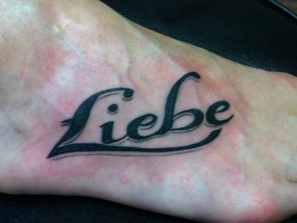 One Word Foot Tattoo