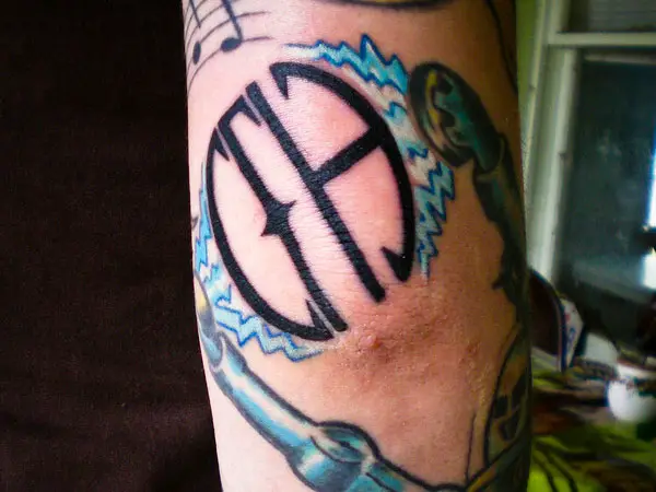 Symbol Elbow Tattoo