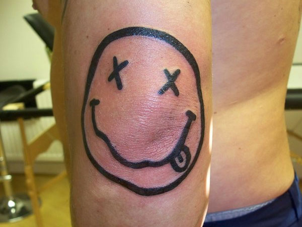 Smiley Elbow Tattoo