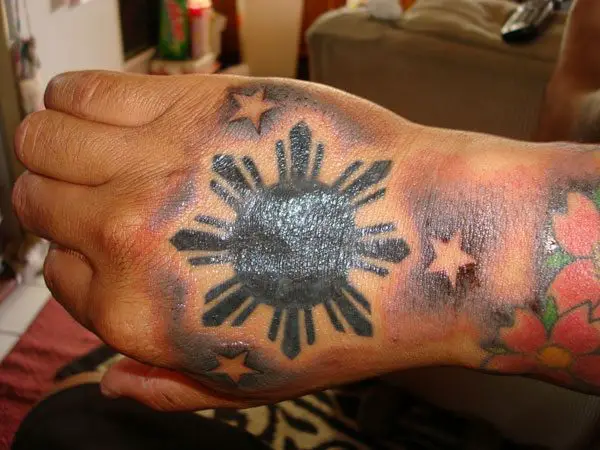 Sampaguita sun tattoo on the inner arm