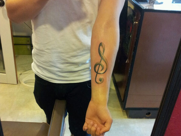 Tattoo of Treble clef Music tattoo  custom tattoo designs on  TattooTribescom