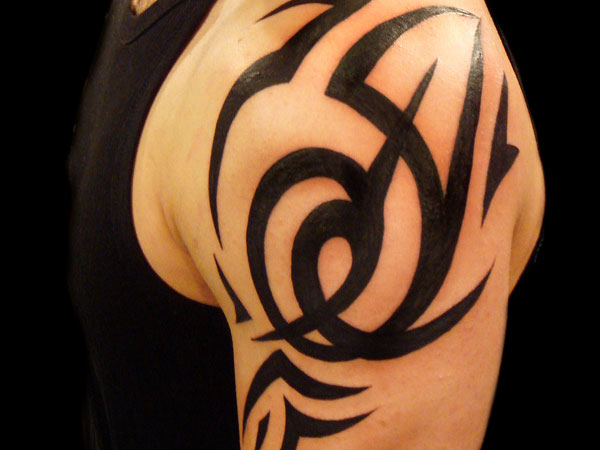 bold tribal shoulder tattoos