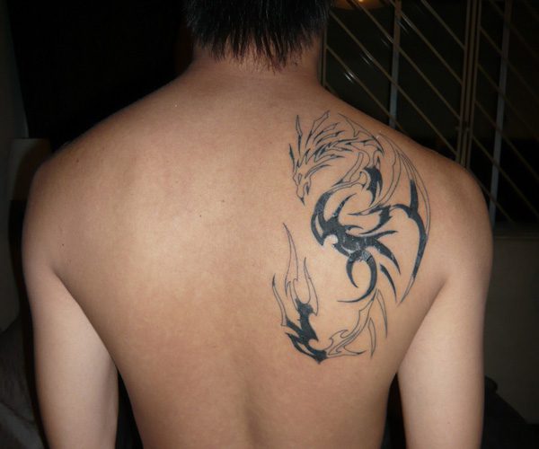 Tribal dragon tattoo back