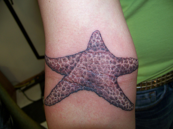 Fish Tattoo Showing Star Fish