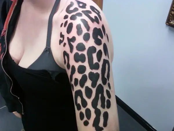 The graphic novel style bold black leopard patterns make a powerful impress...