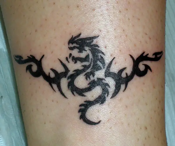 25 encouraging tribal dragon tattoo designs