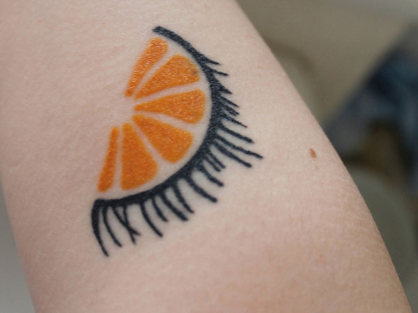 Half Orange Slice Tattoo
