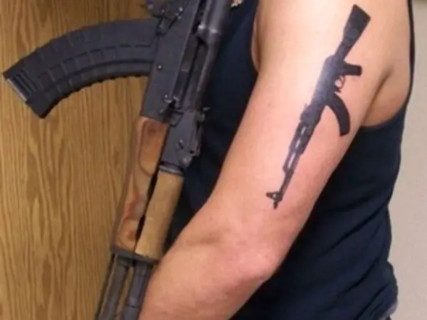 Gun Arm Tattoo