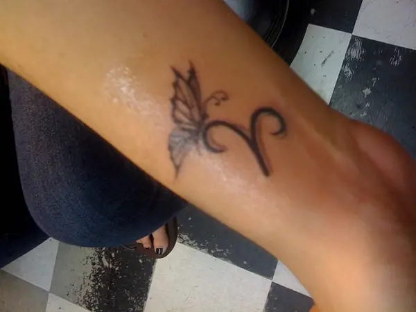 Aries Woman's Butterfly Tattoo