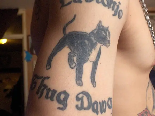 A black panther tattooed along with the words thug life look quite menacing...