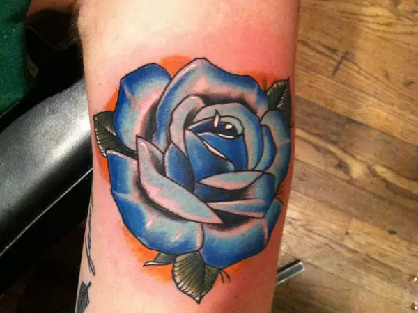 Red rose with blue highlights tattoo  Traditional rose tattoos Neo  traditional roses Flower tattoo shoulder