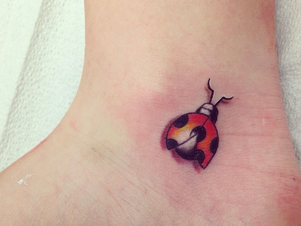 Little ladybug tattoo on the wrist