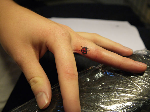 Finger Ladybug Tattoo