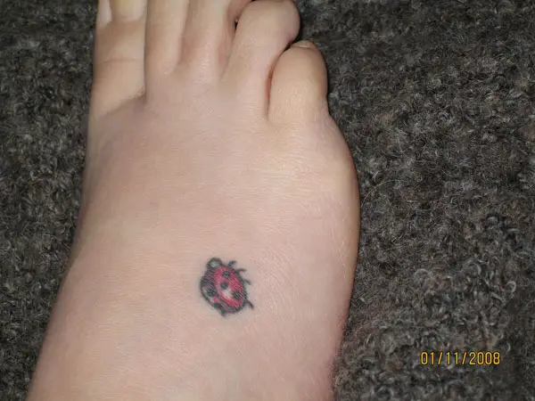 Tiny Ladybug Tattoo