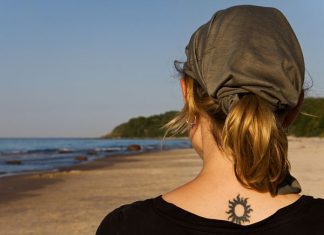 26 Striking Tribal Sun Tattoos