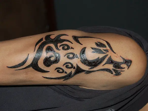 tribal animal arm tattoos