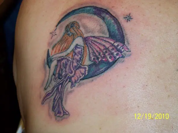 Cinderellas fairy tattoo on the upper arm