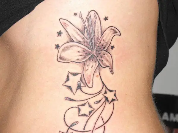 Starry Lily Rib Tattoo 