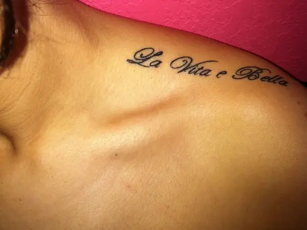 Collarbone tattoo saying Paradiso Italian for