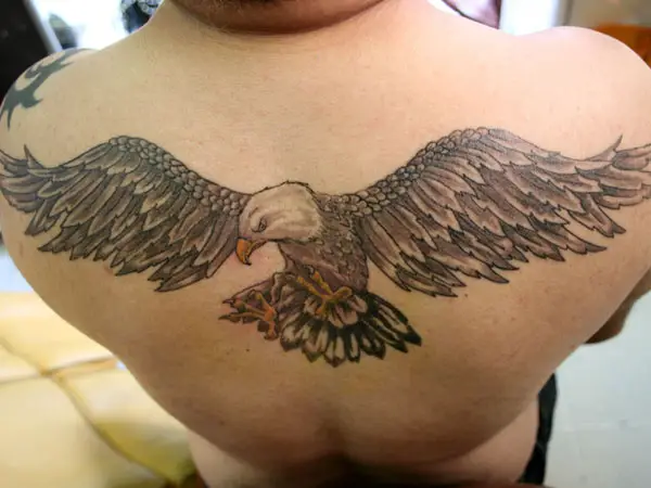 Large eagle tattoo located on the upper back