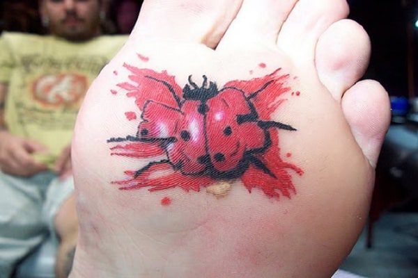 8 Cool Examples of Bottom of the Foot Tattoos ladybug-foot-tattoo