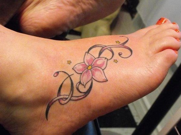 Pink Flower with Yellow Stars Foot Tattoo