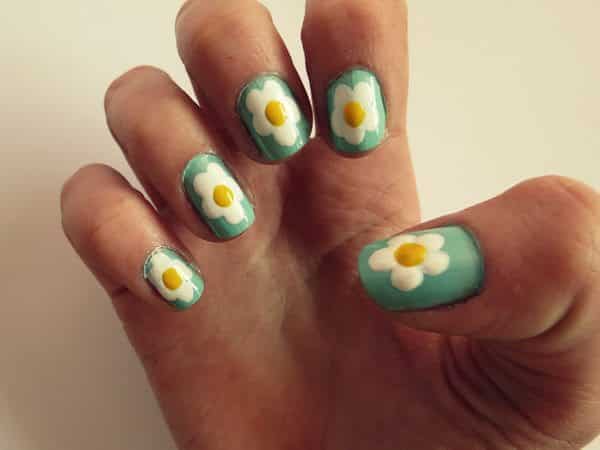 Light Green Nails with One Single Daisy Design