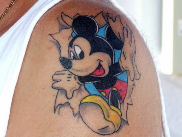 Mickey Mouse Bursting Through Skin Tattoo