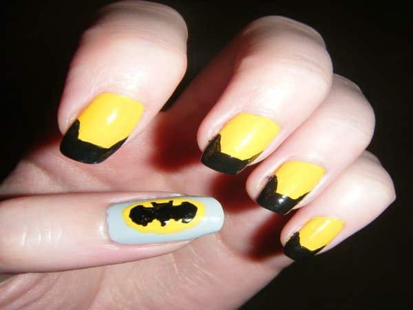 Yellow Nails with Single Grey Thumbnail with Batman Symbol and Batman Cowl